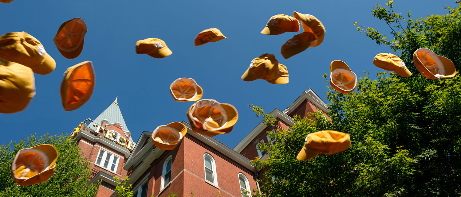 rat caps being thrown into air