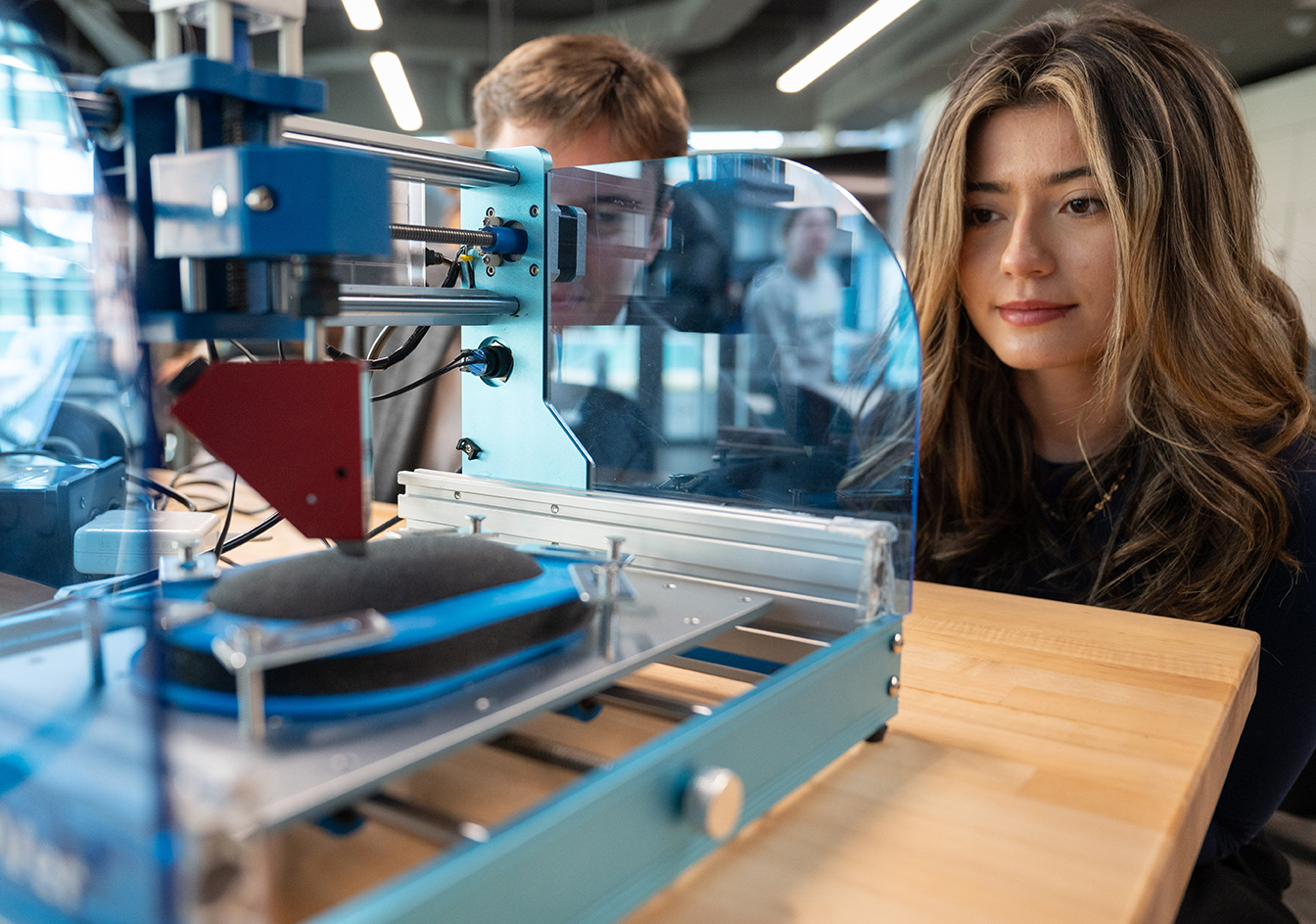 Biomedical engineering students looking at PatchPals – a device that could improve wound care for chronic patients and efficiency in healthcare systems.