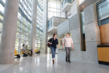 engineering students walk down a hall
