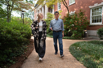 liberal arts students walking on a path