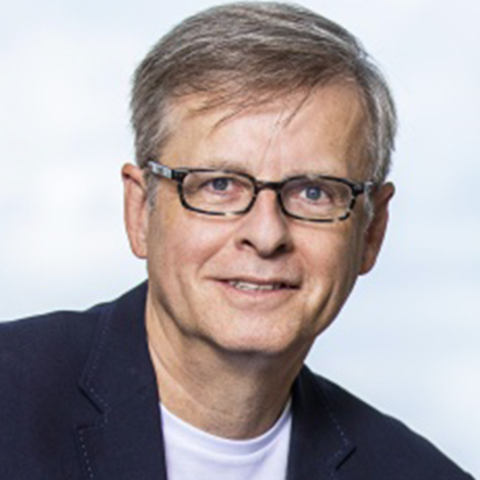 Richard Utz profile photo with blue background