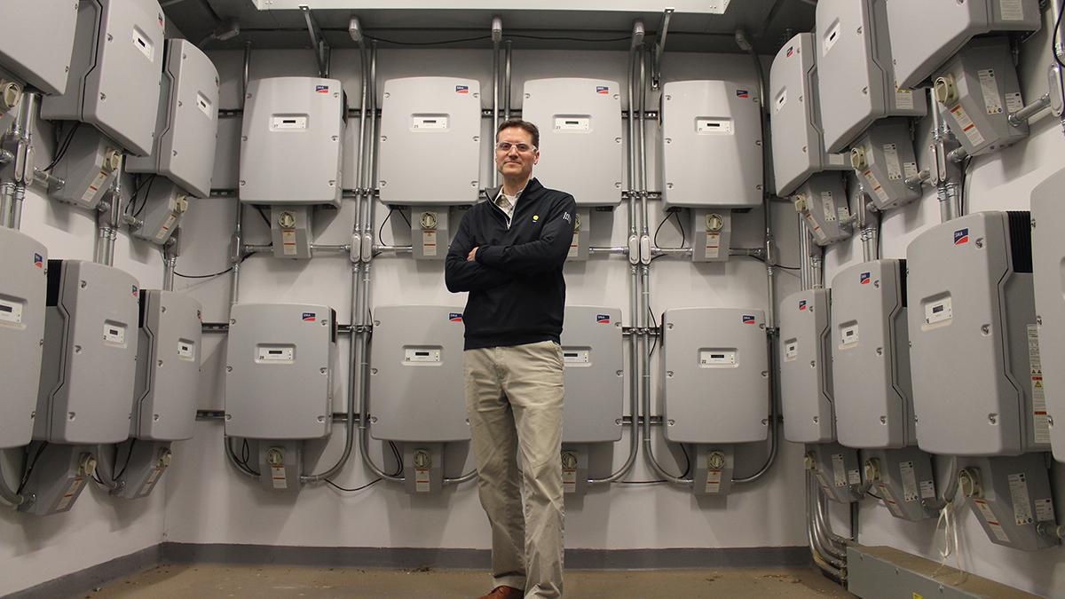 Rich Simmons, principal research engineer and director of Research and Studies at the Strategic Energy Institute, stands in the inverter room of the CNES Lab at Georgia Tech.