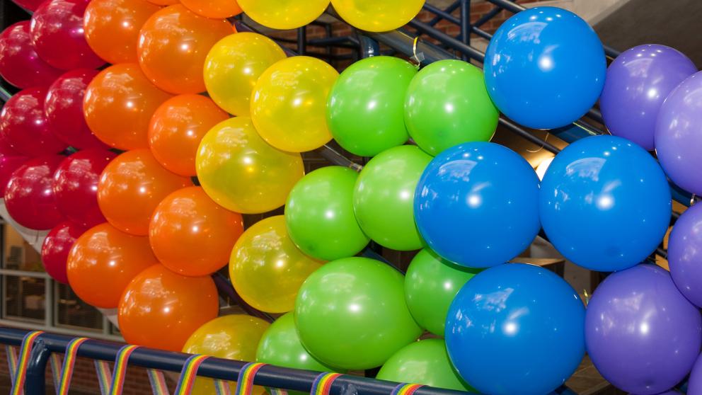 Colorful ballons tied to stair rails