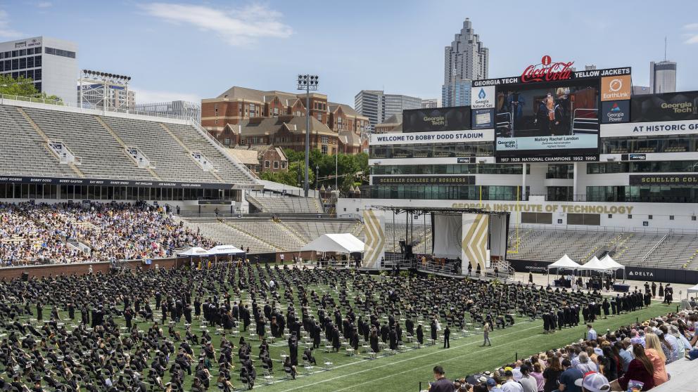 Graduates at Bobby Dodd Stadium for Commencement.