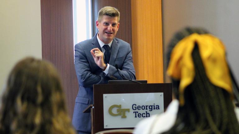 The Atlanta Journal-Constitution's Greg Bluestein speaks during Thursday's seminar at the Bill Moore Student Success Center.