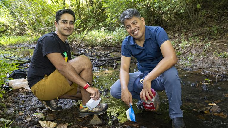 Víctor Ortega-Jiménez and Saad Bhamla exploring a creek to observe springtails.