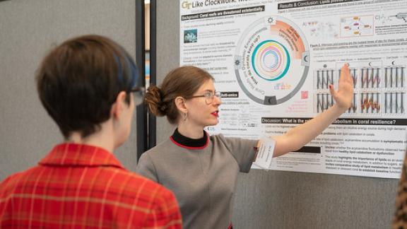 Gretchen Johnson explains her research to a judge during the competition. Gretchen Johnson explains her research to a judge during the competition.