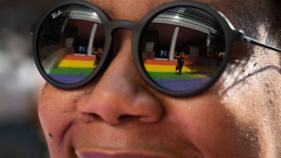 Buzz is reflected in Christen Steele’s glasses as she admires the Progress Pride Staircase at its grand opening in 2021. Photo by Allison Carter Buzz is reflected in Christen Steele’s glasses as she admires the Progress Pride Staircase at its grand opening in 2021. Photo by Allison Carter