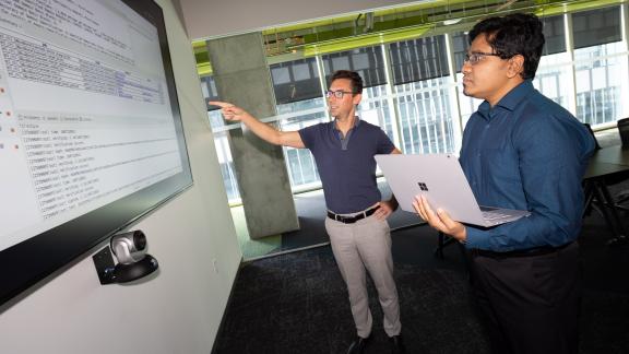 Brendan Saltaformaggio, left, and Amit Sikder are working on a $10 million DARPA project to unpack legacy software systems, incorporate updates, and redeploy them in weeks or months rather than years. (Photo: Candler Hobbs)
Brendan Saltaformaggio, left, and Amit Sikder are working on a $10 million DARPA project to unpack legacy software systems, incorporate updates, and redeploy them in weeks or months rather than years. (Photo: Candler Hobbs)