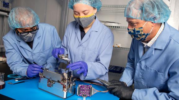 Researchers in Georgia Tech’s School of Aerospace Engineering assemble the Lunar Flashlight’s propulsion system. The project is part of a NASA mission to find frozen water on the moon. (Photo by: Candler Hobbs)