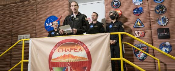 Ross Brockwell exiting the Mars Dune Alpha habitat at NASA's Johnson Space Center in Houston, Texas.