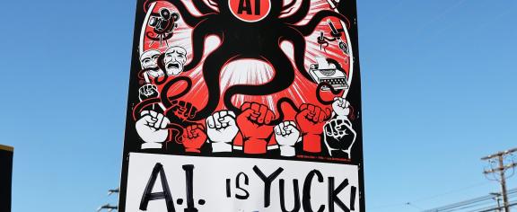 Ethical concerns – like the mistreatment of content creators decried by this protester – drive both veganism and resistance to using AI. Mario Tama/Getty Images