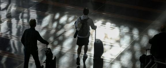 Passengers walk through the Ronald Reagan Washington National Airport on Nov. 7, 2025. Anna Moneymaker/Getty Images