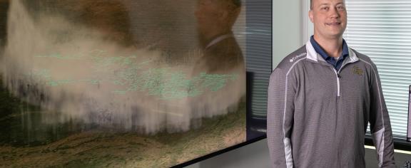 Researcher Michael Peterson with a visualization of the record lightning flash