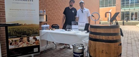 Alumni Christian Doetsch (left) and Seth Lytle brought their VinoBarrel demo to campus during the Tech Square Tech Hop in August.