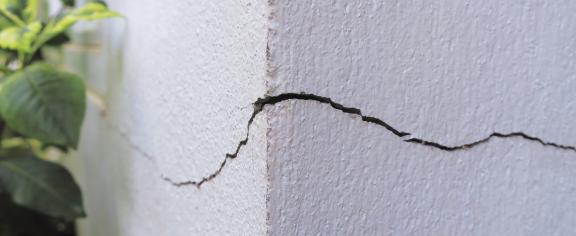 “Cracks are complex — they interact with the material, change shape, and respond dynamically," says Kolvin. "All of this affects the overall toughness, and that impacts safety.” (Adobe Stock)