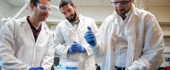 Alex Abramson, Ramy Ghanim, and Abdulraouf Abbas working in the lab.