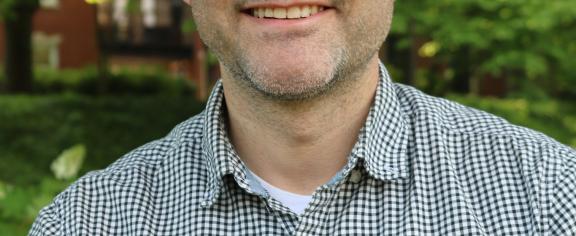 Headshot of a smiling man