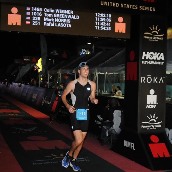Colin Wegner crosses the finish line at the Panama City Beach Ironman Triathlon in November 2022. Submitted photo. 