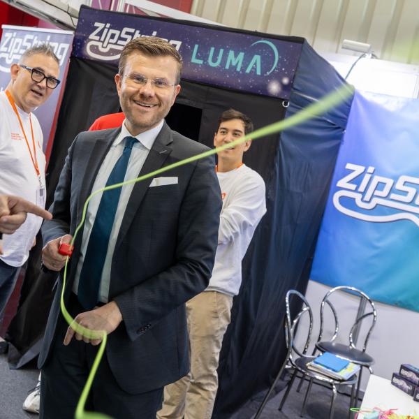 Nuremberg Mayor Marcus König stopped by ZipString's tent at Spielwarenmesse — the world's largest toy fair.