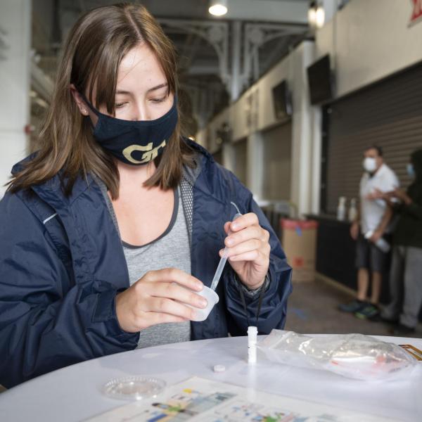 A student participates in Covid-19 surveillance testing.
