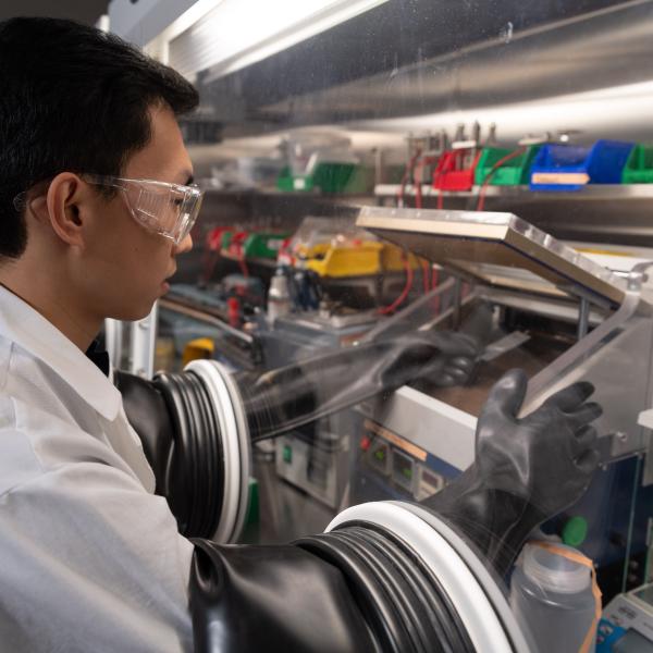 Postdoctoral researcher Dr. Congcheng Wang builds a battery cell.
