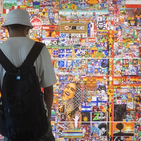 Student observing art display on campus. Photo by Allison Carter